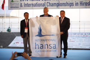 Handover of Hansa Class Flag from Hiroshima to Steve Bender, Chair of OC for 2020 Hansa Worlds in Newport Beach CA, USA